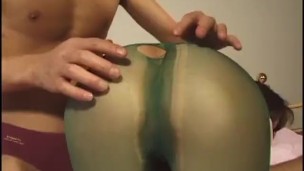 Oriental girl in ripped pantyhose bends over and sucks cock for two guys