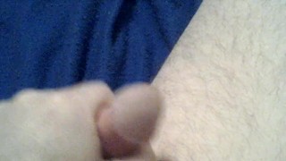 Cock playing with a red dildo