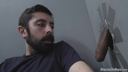 Bearded white man sucking and fucking a ebony cock at a gloryhole