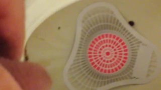 Pissing at the park urinal