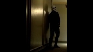 skeleton faced frogman in hotel