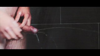 Stunning young cock pissing jeans in the shower