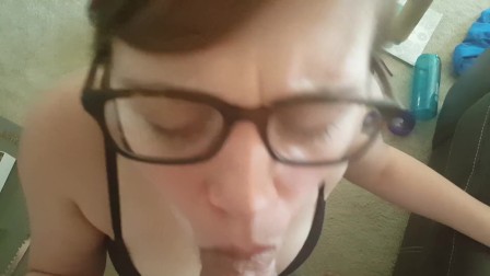girl gives sloppy blowjob. Gets cum on her glasses!!