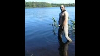 jerking off in lake wearing spandex tights, latex gloves and stocking mask