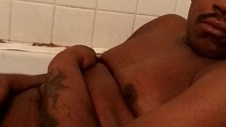 In the tub about to cum