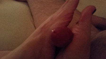 Rubbing his cock with my feet
