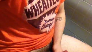Horny college student with big dick jacks off in university restroom
