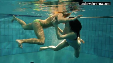 Two sexy amateur showing their bodies off under water