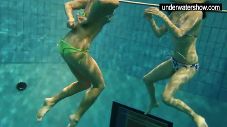 Two sexy amateur showing their bodies off under water