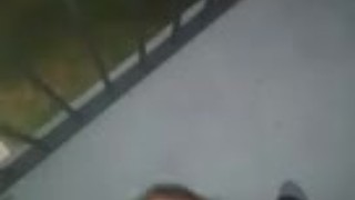 Playing with my cock on the balcony