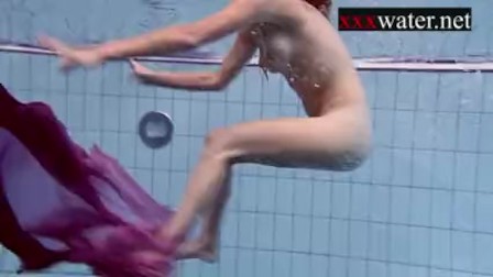 Smoking hot Russian redhead in the pool