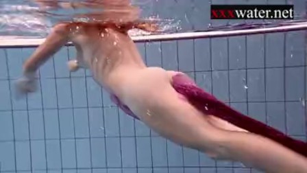 Smoking hot Russian redhead in the pool