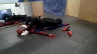 black sex drone playing with his spiderman dummy