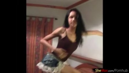 Thai ladyboy in jean skirt is dancing and revealing bigtits