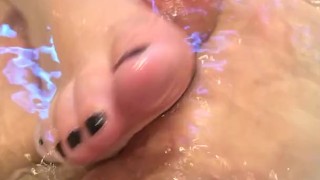 Wife gives relaxing footjob on jacuzzi