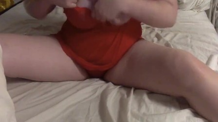 Young masked mother playing in bed