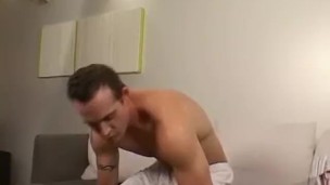 A tall hunk is jerking his cut cock while playing with socks
