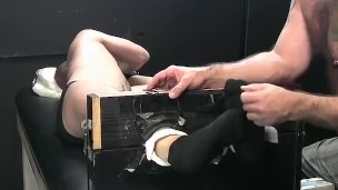 Dark haired dude begging for mercy while tied and tickled