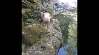 MILF flashing and masturbating by the river