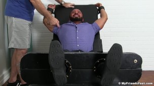 Damian Taylor is bound to the torture bed and gets tickled