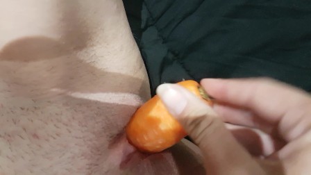 Sexy slut fucking herself with a carrot