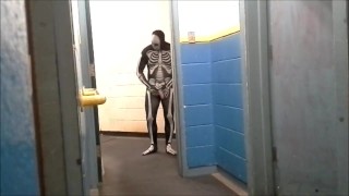 skeleton with hard on jerks off in gym hall
