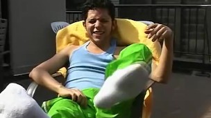Slim homosexual Rodrigo shows his hairy feet outdoors