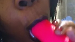 Sexxx Angel Sucking on her pink dildo