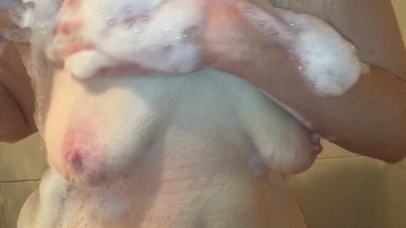 Playing with soapy boobs in the shower