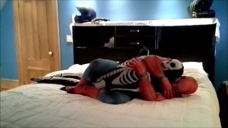 spiderman having fun with his toy skeleton