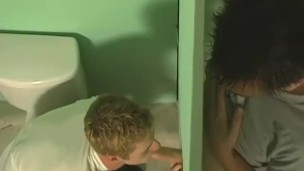 Twink blowing two cocks at the gloryhole for that jizz