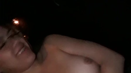 Pretty busty teen touches tits for her guy while driving.