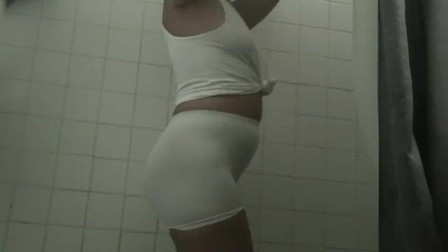 White spandex shorts and white t shirt in the shower transparent