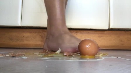 Red nails barefoot feet crushing eggs