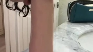 Deep throating a dildo