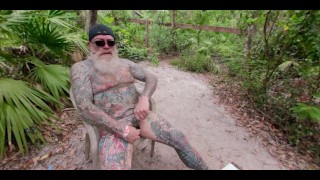 Inked Daddy Bear Stroking and Pissing in the Woods