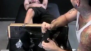Tickling master showing his tricks to restrained submissive