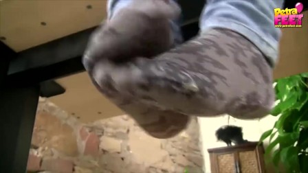 teen feet in socks with white nail polish