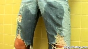 Hot young guy pisses his pants and jacks off his thick dick