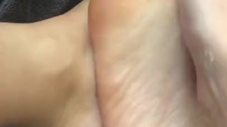size 6.5 feet being rubbed with lotion