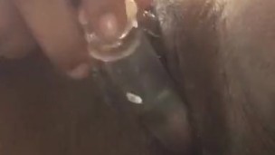Ebony BBW with glass dildo making the pussy cream and drip