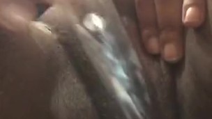Ebony BBW with glass dildo making the pussy cream and drip