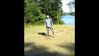 armed zentai skeleton outdoors in the sun