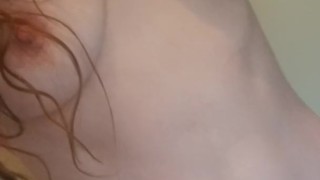 Slut plays with her small tits