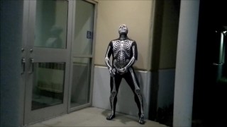 nighttime skeleton jerking off in front of outside doors