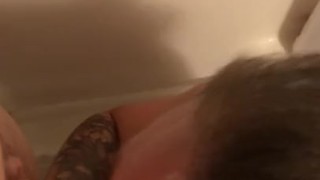 Tattooed Milf gives blowjob in shower, gets facial
