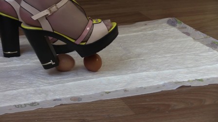 crashes eggs with high heels, mature lady in high-heeled shoes