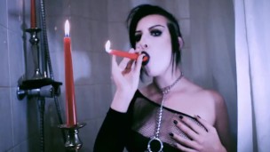Vampire Goth Plays with Candles
