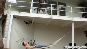 Handsome stud pisses on his twink lover from a balcony
