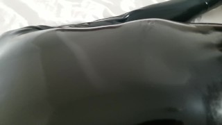 Close-up latex cock and mask